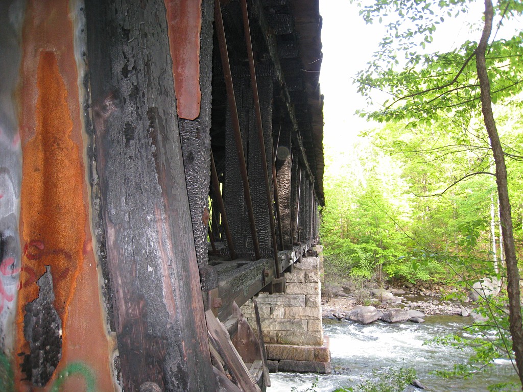 Tilton NH Rail Trail 2010 0210.jpg - Winnipesaukee River Trail, Franklin New HampshireTrestle View ParkInterested in taking a walk or bike ride on a scenic historic trail close to the downtowns of the twin rivers area, yet with the feel of wilderness. A 3 mile trail parallels the Winnipesauke river and passes the historic Sulphite upside down covered bridge believed to be the only one in the country and listed on the national register of historic places. You will also view mill ruins and remaining portions of dams that tell the history of the 5 mills that operated on this river in the mid 19th century.